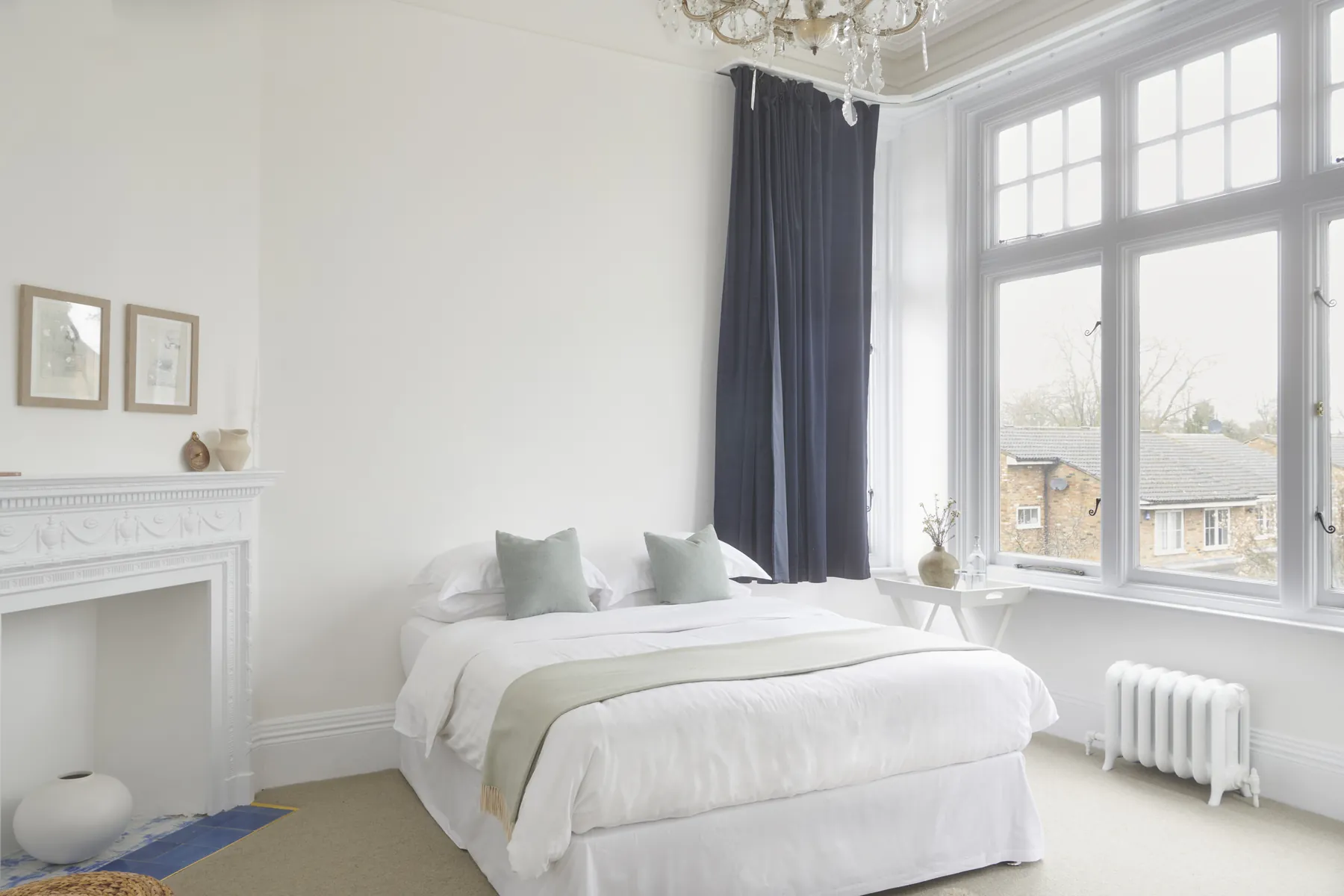 Being Julia, a bright deluxe double with tall windows and a carved fireplace