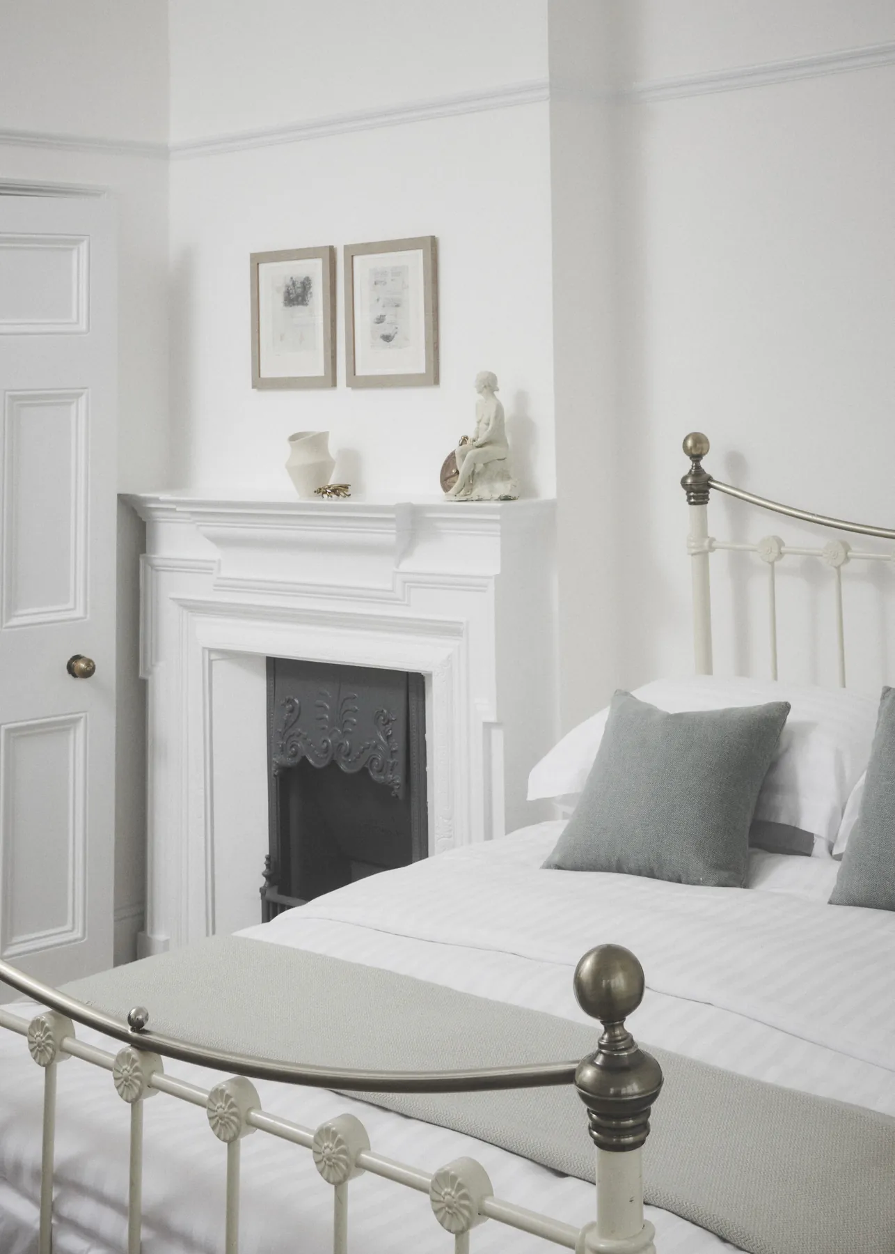 A brass bedstead and a white mantelpiece in Boulter's Lock