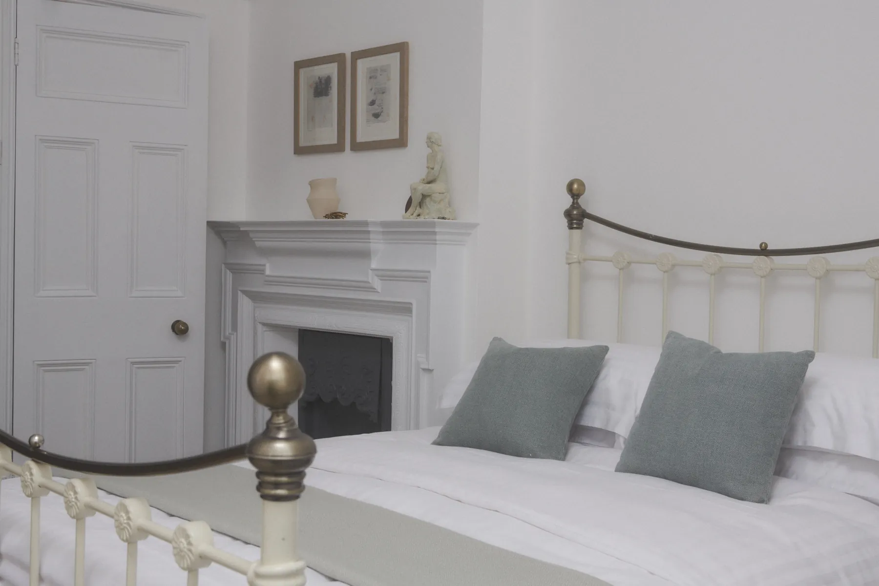 The ornamental fireplace beside the bed in Boulter's Lock