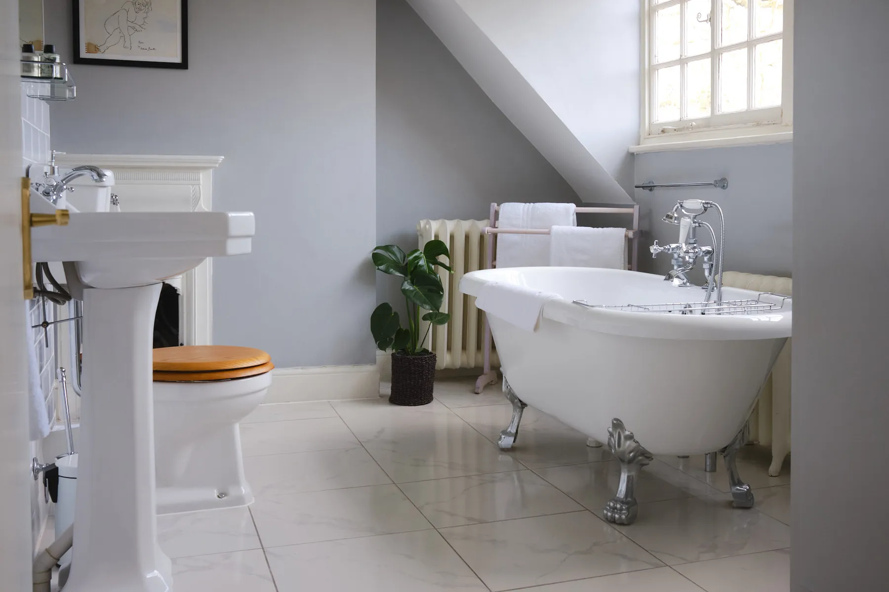 The Turner's Studio bathroom, with a roll-top bath beneath the eaves